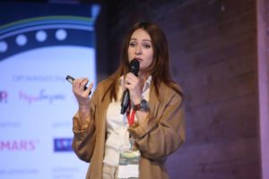 Anna Shevchenko on stage at Digital Communications Conference, Russia